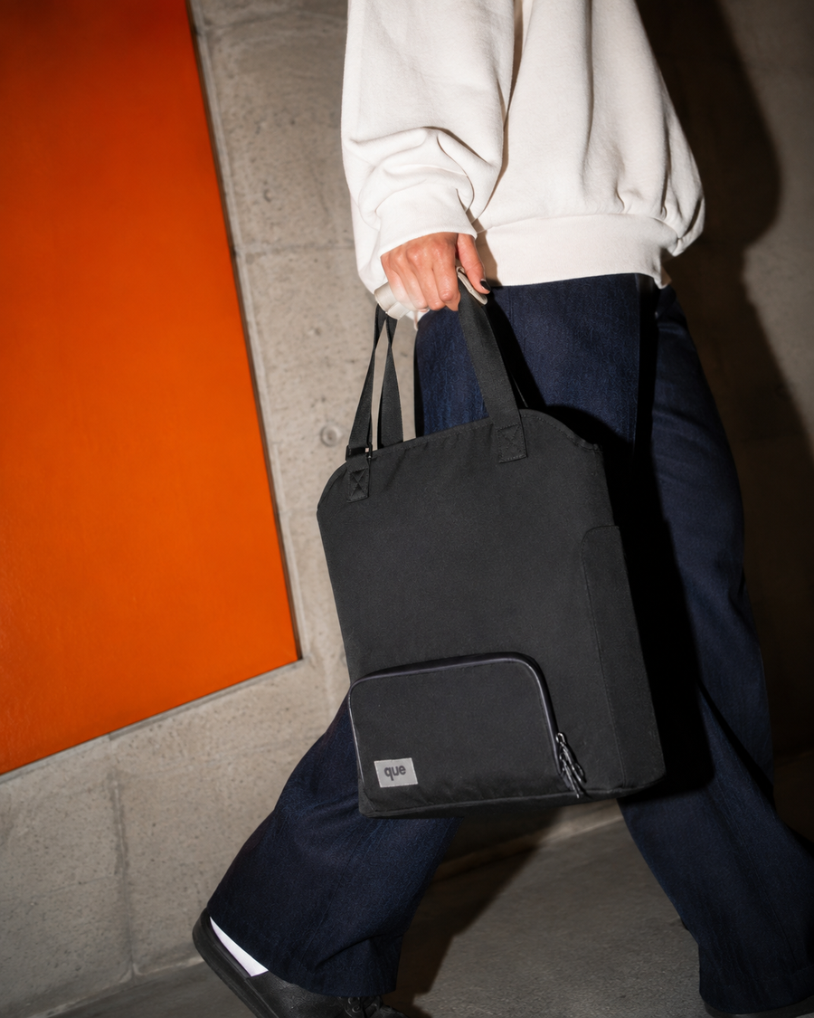 The Convertible Totepack carried in-hand