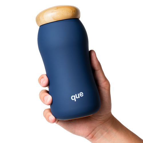 A hand gripping the Insulated Bottle's ergonomic curve