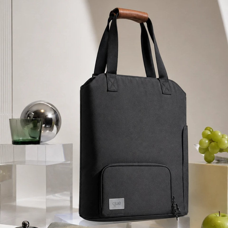 The Convertible Totepack standing on a chair